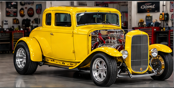 Bright yellow 1932 Ford Deuce Coupe in the shop